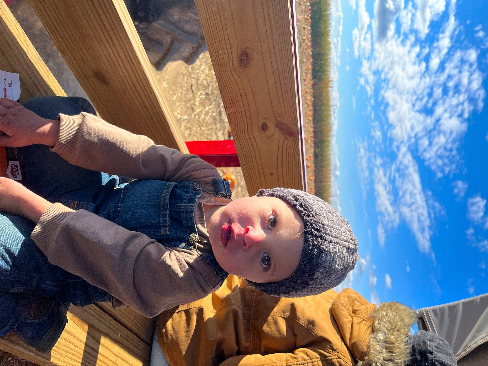 Kit is registered to the contest to win money with this photo: child, cloud, denim, electric_blue, flash_photography, fun, happy, headwear, human_leg, landscape, leisure, pattern, person, portrait_photography, sitting, sky, tourism, travel, vacation, winter