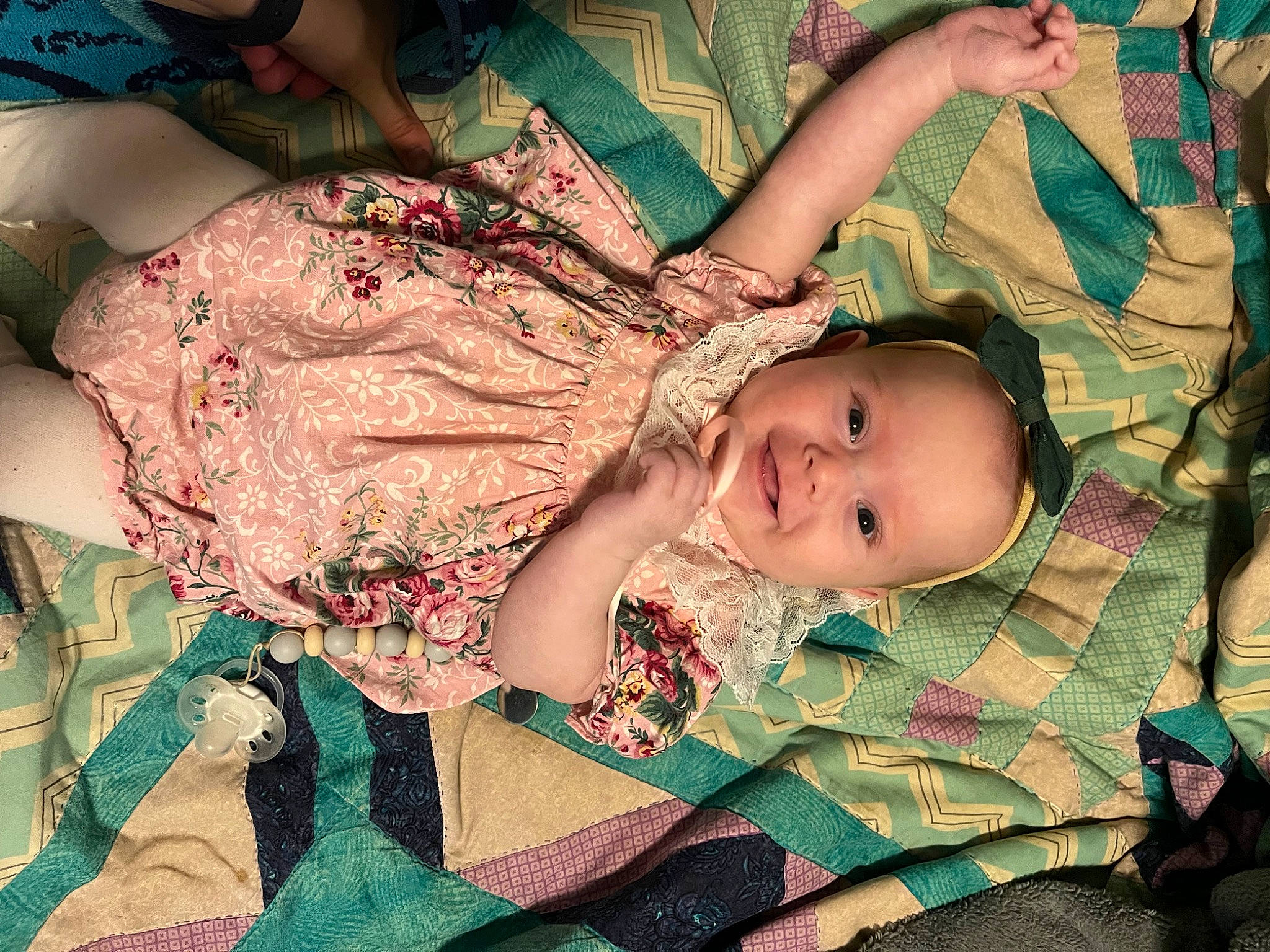 Saige is registered to the contest to win money with this photo: abdomen, baby, baby_toddler_clothing, chest, child, comfort, eye, grass, green, happy, head, joy, military_camouflage, pattern, person, plant, skin, sleeve, smile, toddler