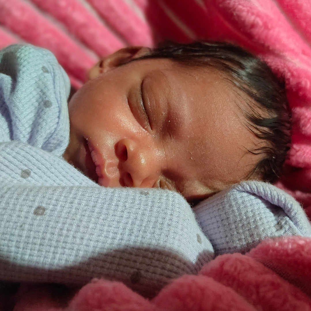 May'Lanni is registered to the contest to win money with this photo: baby, blanket, child, closed_eyes, cozy, cute, face, indoor, infant, newborn, peaceful, pink_blanket, portrait, relaxation, resting, sleeping, soft_texture, toddler, warm, wrapped