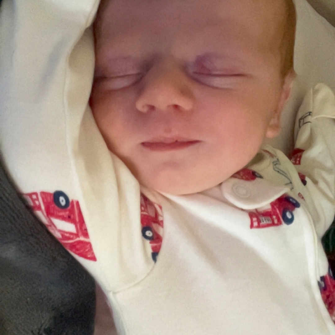 Kolton Klay joined the competition — help win amazing prizes! baby, blanket, child, clothing, comfort, cute, face, fire_truck, indoors, infant, newborn, onesie, peaceful, portrait, relaxation, resting, sleeping, soft, toddler, young