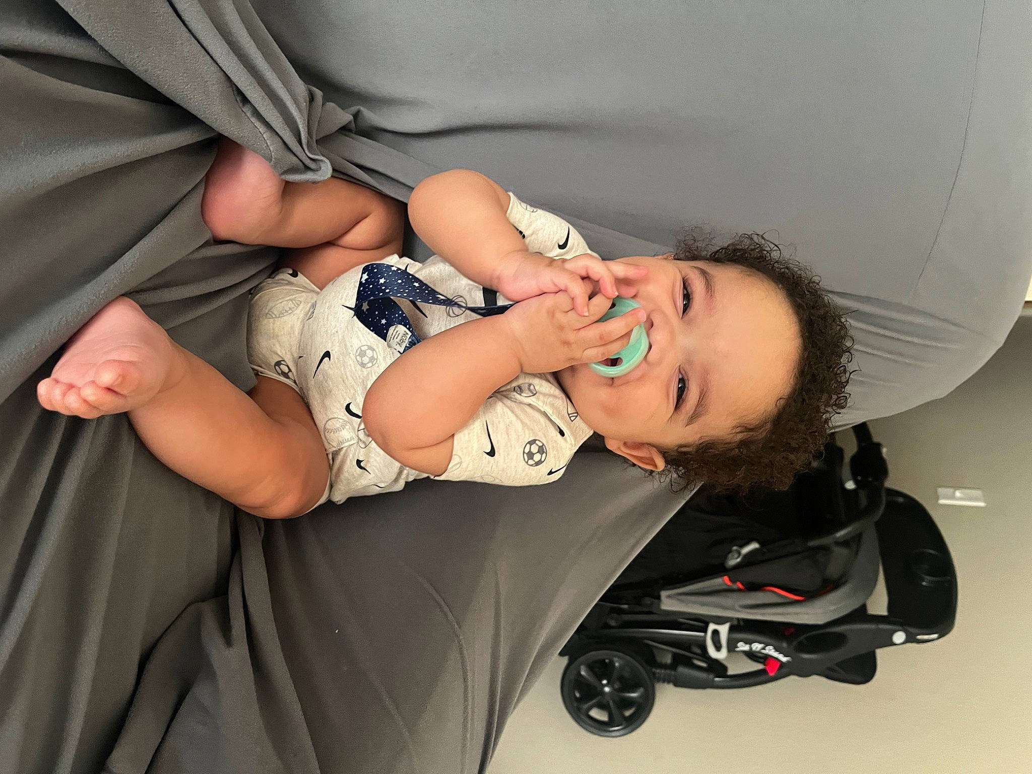 Kai is registered to the contest to win money with this photo: abdomen, arm, automotive_design, baby, baby_carriage, baby_products, baby_toddler_clothing, comfort, elbow, eye, fashion_accessory, gesture, hand, human_body, human_leg, knee, person, skin, sleeve, thigh