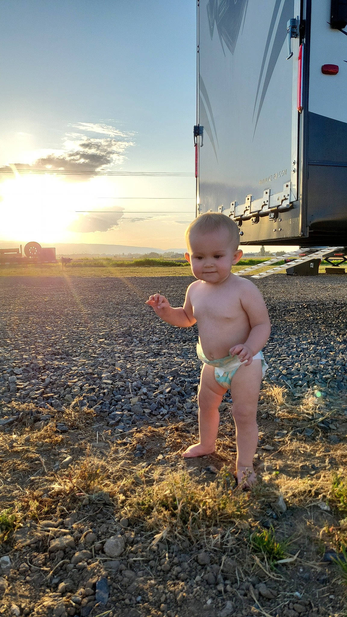 Blakelyn is registered to the contest to win money with this photo: baby, barechested, barefoot, body_of_water, child, cloud, flash_photography, fun, grass, happy, human_leg, joy, landscape, leisure, people_in_nature, people_on_beach, person, sand, sky, standing