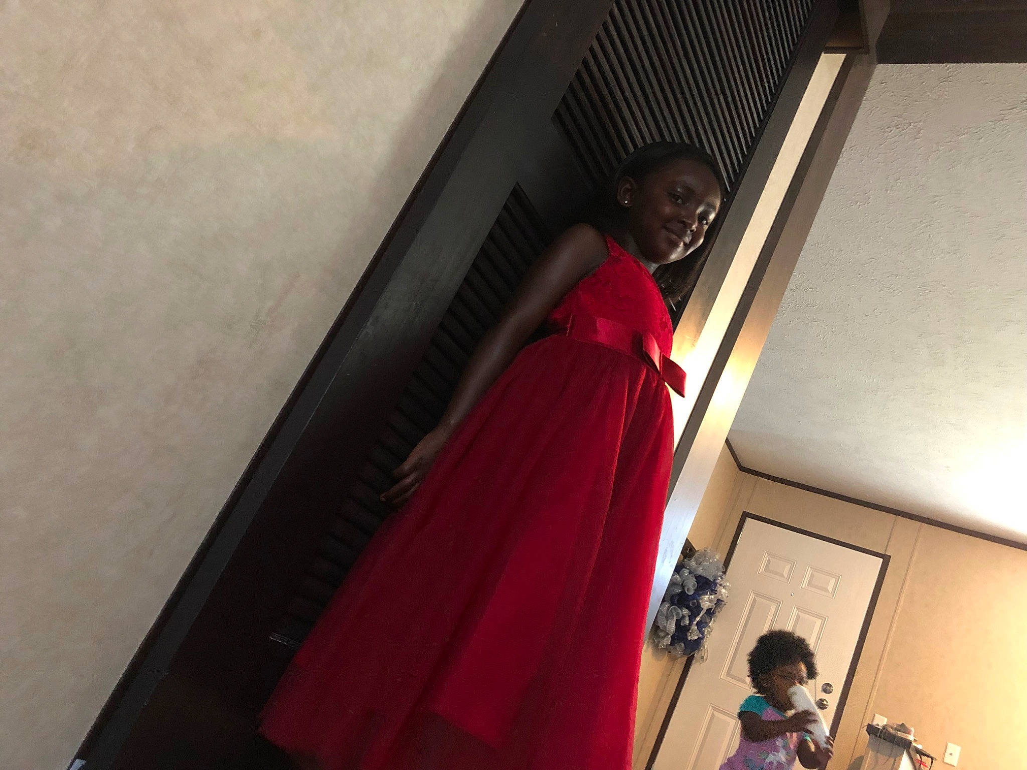 Kristen is registered to the contest to win money with this photo: fun, joy, person, red, standing, temple