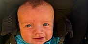 Aaron joined the competition — help win amazing prizes! baby, blue_jacket, child, clothing, cute, eyes, face, happy, head_support, infant, outdoor, person, portrait, seat, smiling, straps, stroller, sunlight, under_armour_logo, young_child