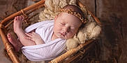 Thalia participe au concours pour gagner de l'argent avec cette photo : adorable, baby, basket, blanket, child, closeup, cozy, cute, headband, infant, newborn, peaceful, portrait, resting, sleeping, soft, toddler, wooden_floor, wool, wrapped