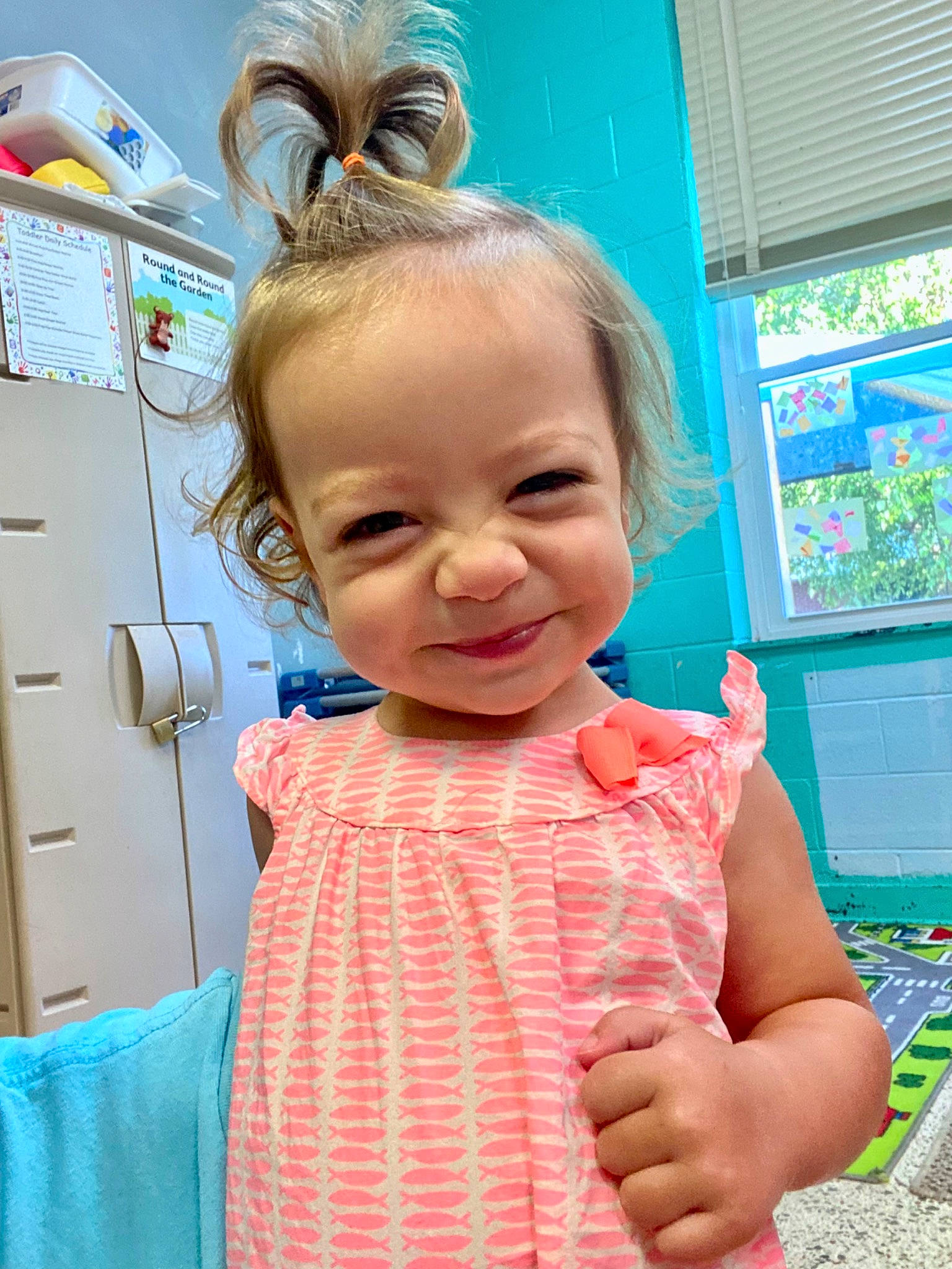 Karrigan is registered to the contest to win money with this photo: baby_toddler_clothing, blue, child, chin, electric_blue, eyewear, fun, gesture, green, hairstyle, happy, headpiece, joy, organ, pattern, person, pink, skin, sleeve, smile