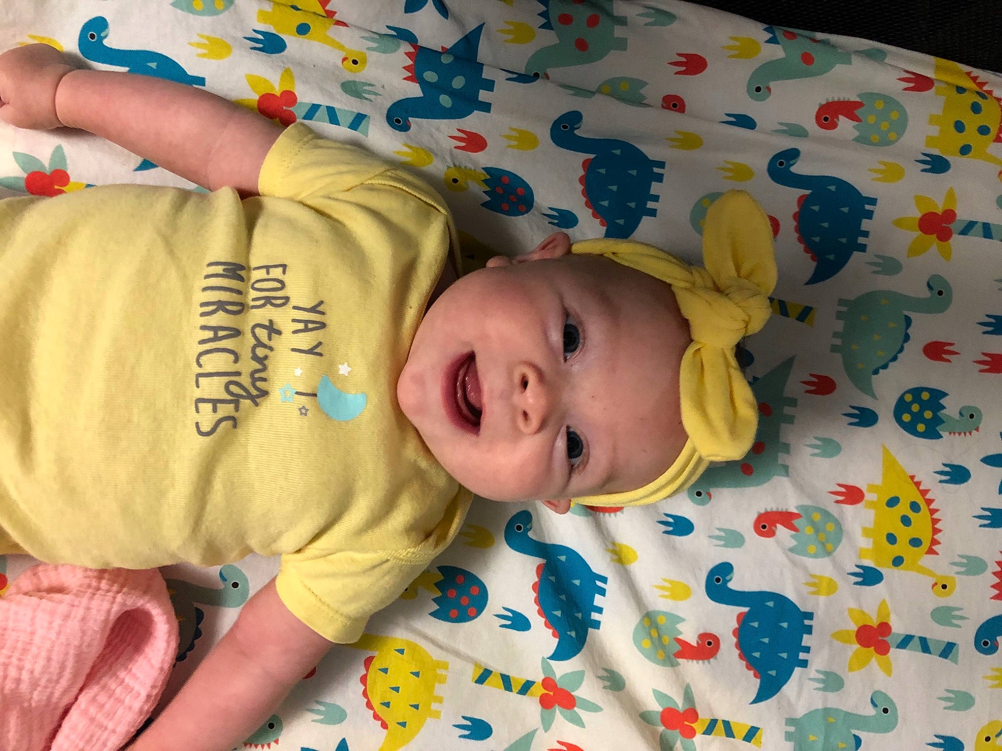 June is registered to the contest to win money with this photo: baby, baby_products, baby_safety, baby_toddler_clothing, blue, cheek, child, comfort, fun, happy, headwear, linens, pattern, people, person, room, skin, sleeve, smile, textile