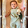 Rosemary joined the competition — help win amazing prizes! baby, child, clothing, crib, curly_hair, cute, face, green_overalls, infant, newborn, nursery, peaceful, person, pink_bedding, plush_toy, portrait, ruffle, sleeping_area, soft_lighting, wooden_sign