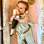 Rosemary is registered to the contest to win money with this photo: baby, baby_clothes, bed, checkered_pattern, child, comfort, crib, cute, green_clothing, indoor, infant, milestone, milestone_marker, pacifier, plush_toy, portrait, resting, soft_toy, wooden_beads, young_child