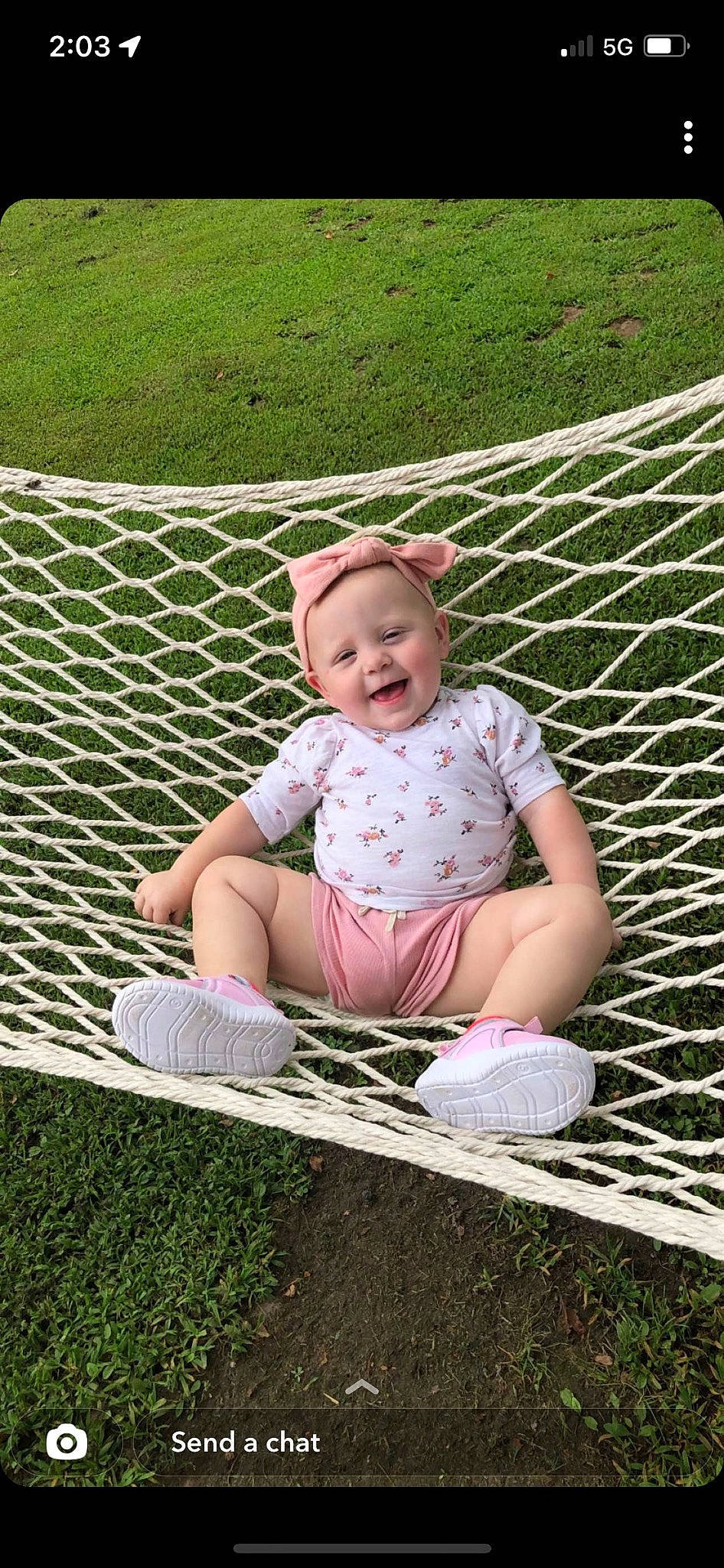 Maddyson is registered to the contest to win money with this photo: baby_toddler_clothing, child, fun, grass, grass_family, happy, joy, lawn, leaf, leisure, mesh, pattern, people_in_nature, person, pink, recreation, shoe, sitting, smile, sneakers