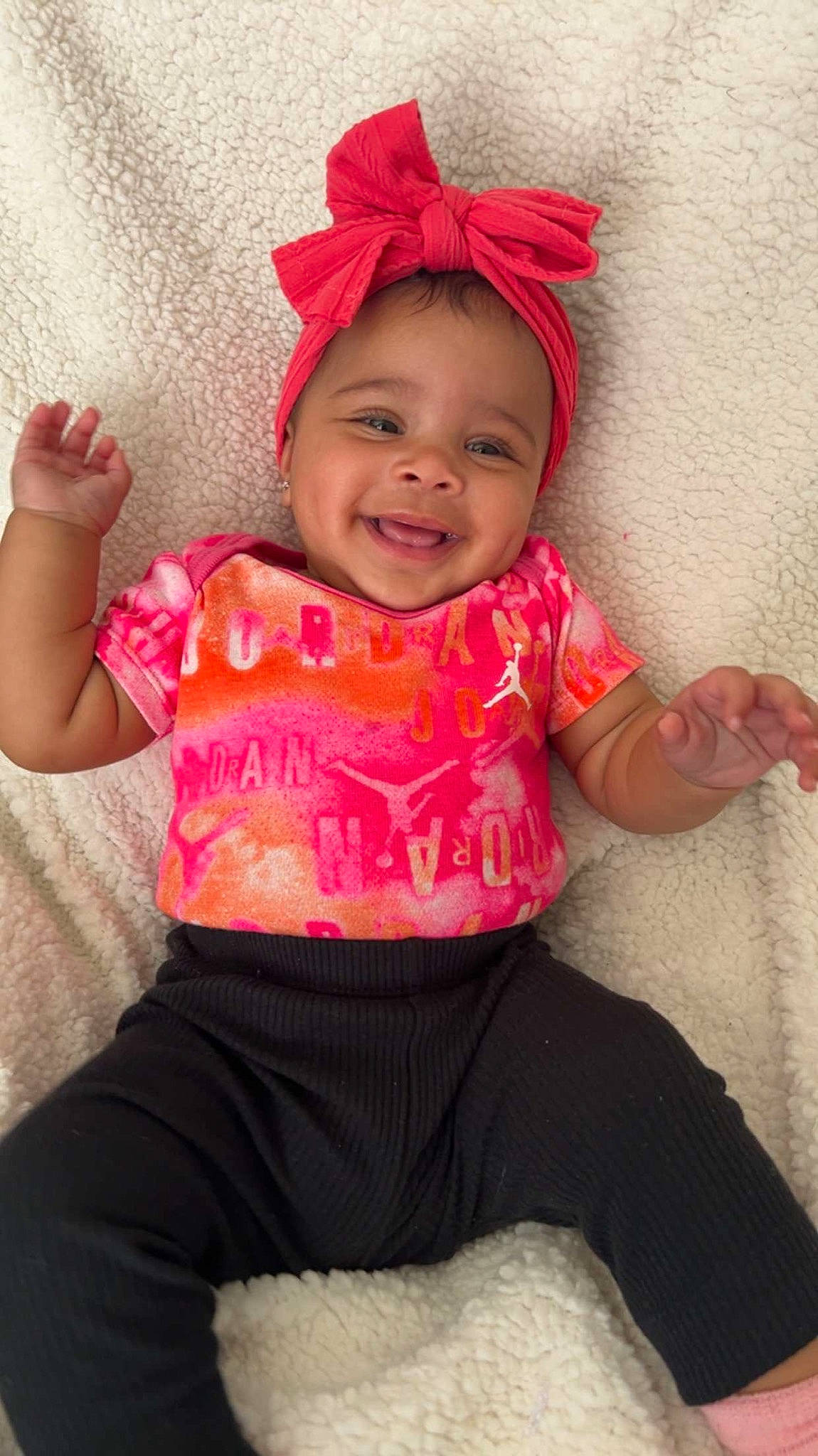 Kaylani is registered to the contest to win money with this photo: baby_toddler_clothing, cap, eye, face, facial_expression, finger, happy, head, headgear, human_body, jeans, joy, lip, neck, person, pink, skin, sleeve, smile, standing