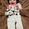 Azalea joined the competition — help win amazing prizes! baby, infant, smiling, happy, plush_toy, stuffed_animal, cow_toy, onesie, clothing, blanket, fur_texture, soft_toy, cute, child, face, hands, lying_down, indoor, person, portrait