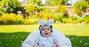 Azalea joined the competition — help win amazing prizes! baby, bunny_ears, child, cushion, cute, dress, flowers, garden, grass, greenery, happy, headband, infant, nature, outdoor, person, playful, portrait, smiling, sunny