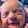 Nalah is registered to the contest to win money with this photo: baby, newborn, close_up, face, smile, sleeping, infant, skin, cute, child, wrapped, blanket, cozy, peaceful, indoors, human, portrait, young, adorable, soft