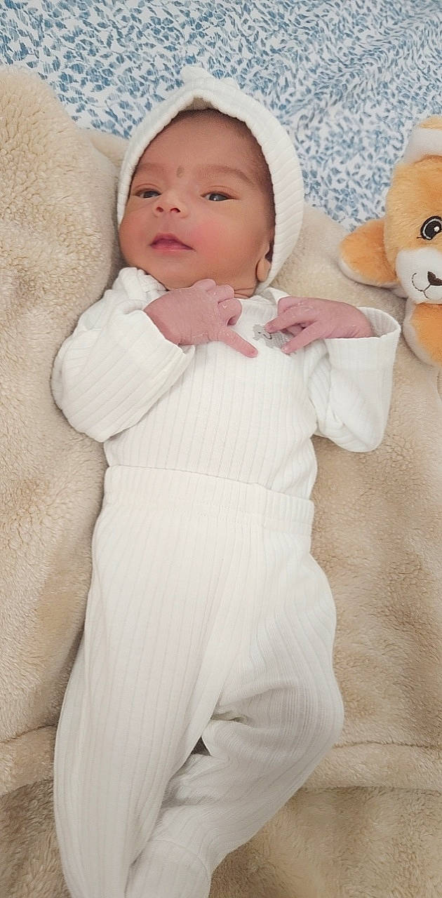 Vihan Nathan Khalil is registered to the contest to win money with this photo: baby, baby_sleeping, baby_toddler_clothing, cheek, child, comfort, face, fur, linens, peach, person, portrait_photography, skin, sleeve, smile, stuffed_toy, textile, toddler, toy, white