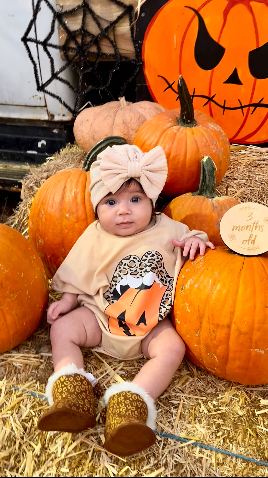 Anastasia is registered to the contest to win money with this photo: black, calabaza, facial_expression, gourd, grass, happy, head, headwear, local_food, natural_foods, orange, people, people_in_nature, person, photograph, pumpkin, squash, toddler, vegetable, whole_food