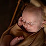 baby, basket, blanket, closeup, cozy, foot, head, indoors, infant, newborn, peaceful, portrait, resting, skin, sleeping, smile, soft_lighting, swaddle, tiny_toes, wicker