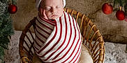 Isaac participe au concours pour gagner de l'argent avec cette photo : baby, christmas_ornament, cozy, cushion, festive, holiday_theme, infant, newborn, peaceful, pine_branch, portrait, red_bauble, santa_hat, seasonal_decor, sleeping, snowy_floor, striped_wrap, studio_shot, wicker_basket, wrapped