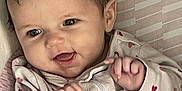 Kennidi joined the competition — help win amazing prizes! baby, infant, smiling, happy, onesie, heart_pattern, hands, face, cute, child, portrait, indoors, soft_lighting, cozy, young, expression, cuddly, skin, head, eyes
