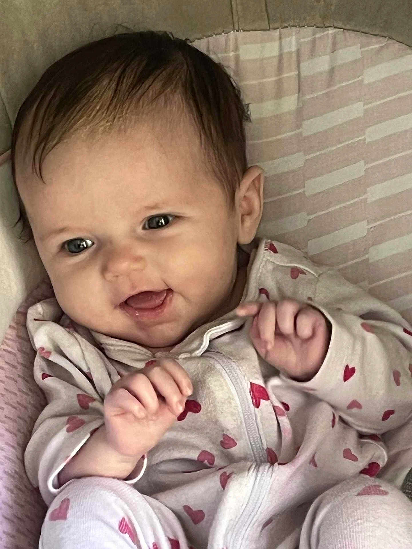 Kennidi joined the competition — help win amazing prizes! baby, infant, smiling, happy, onesie, heart_pattern, hands, face, cute, child, portrait, indoors, soft_lighting, cozy, young, expression, cuddly, skin, head, eyes