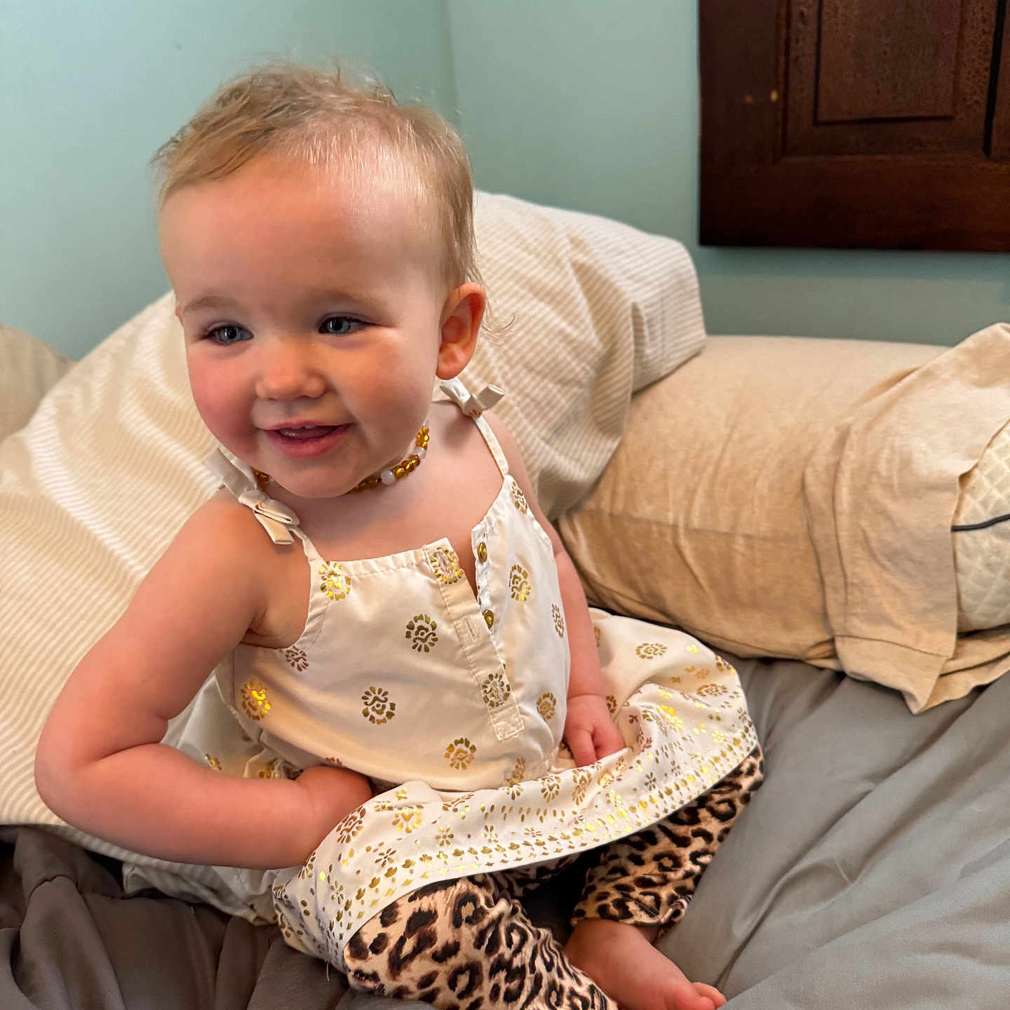 Selah-Belle is registered to the contest to win money with this photo: accessories, baby, bodypart, clothing, couch, cushion, dress, face, finger, furniture, hand, happy, head, homedecor, jewelry, person, photography, portrait, sitting, smile