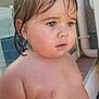 toddler, child, wet_hair, blue_eyes, earrings, skin, water_droplets, outdoor, portrait, close_up, bare_chest, expression, curly_hair, person, young_child, summer, daylight, window, pipe, background