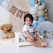 Yzael joined the competition — help win amazing prizes! toddler, child, birthday, one_year_old, balloons, teddy_bear, bow_tie, suspenders, decorations, white_bed, pastel_colors, stars, indoor, celebration, cute, portrait, happy, party, baby, smiling