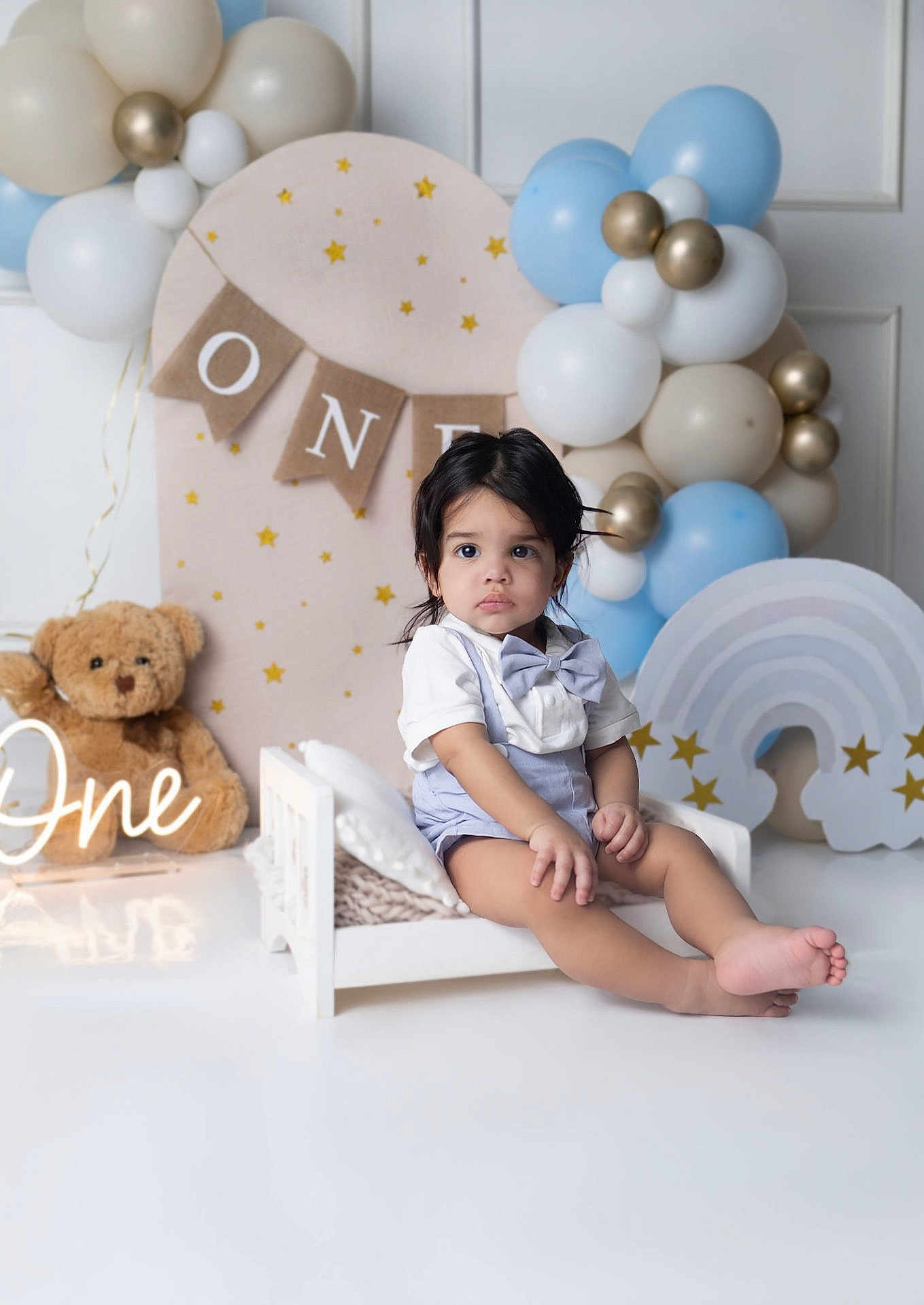 Yzael joined the competition — help win amazing prizes! toddler, child, birthday, one_year_old, balloons, teddy_bear, bow_tie, suspenders, decorations, white_bed, pastel_colors, stars, indoor, celebration, cute, portrait, happy, party, baby, smiling