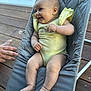 baby, infant, smiling, yellow_outfit, baby_bouncer, gray, wooden_deck, hand, outdoor, cute, chubby, sitting, happy, skin, face, legs, feet, person, child, portrait