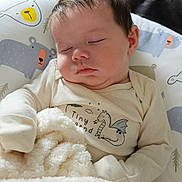 Colsen joined the competition — help win amazing prizes! baby, sleeping, blanket, onesie, pillow, cartoon_bear, face, infant, cozy, cute, child, indoors, soft, peaceful, portrait, clothing, resting, furniture, home, nap