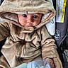 Andrew joined the competition — help win amazing prizes! baby, infant, child, car_seat, bottle, hoodie, costume, plush, wide_eyes, cute, sitting, clothing, fuzzy, baby_bottle, seatbelt_warning, indoor, portrait, young_child, face, hand