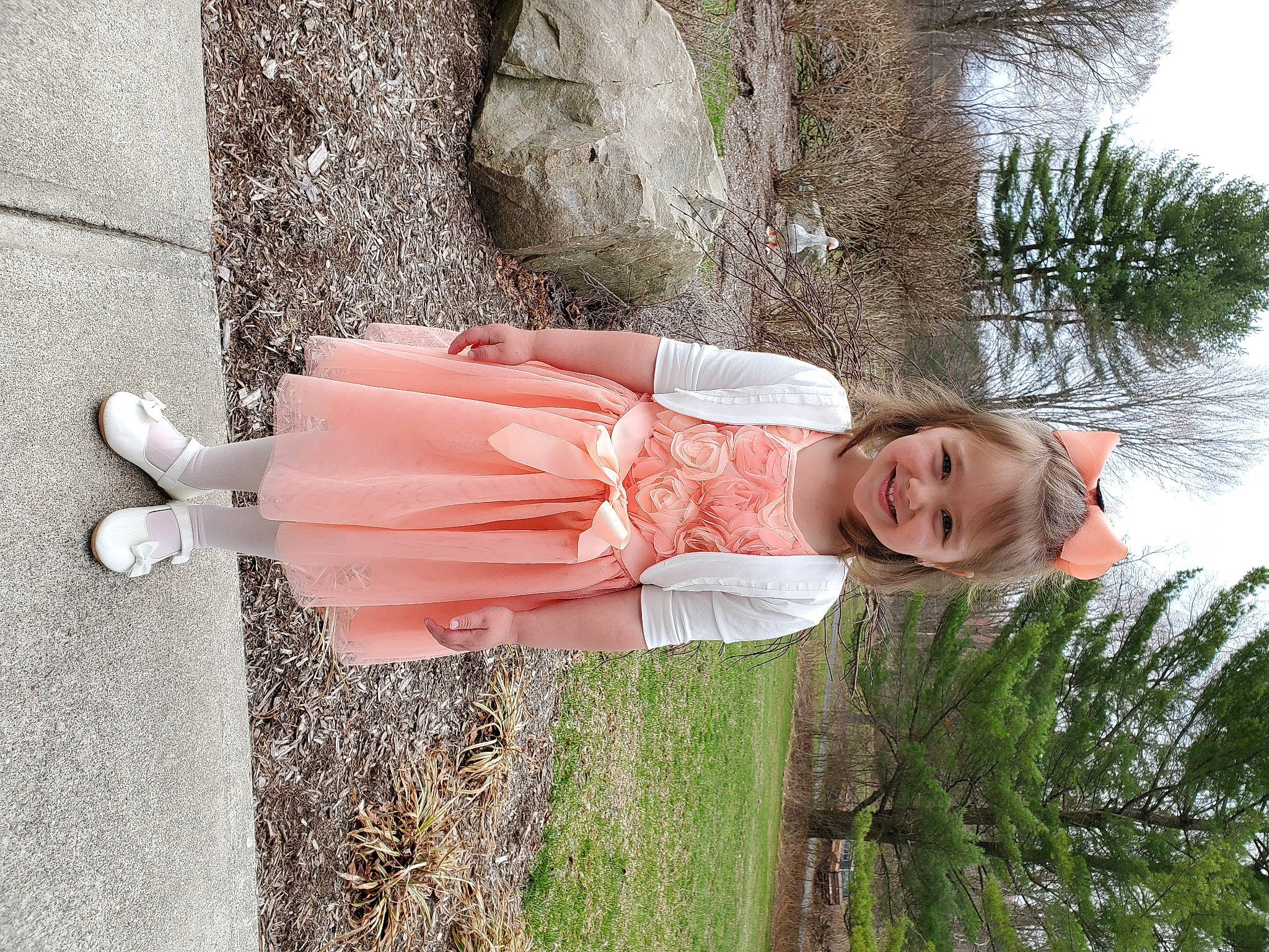 Victoria is registered to the contest to win money with this photo: day_dress, fun, grass, happy, human_leg, joy, leisure, peach, people_in_nature, person, plant, sandal, smile, street_fashion, tree, waist, wood