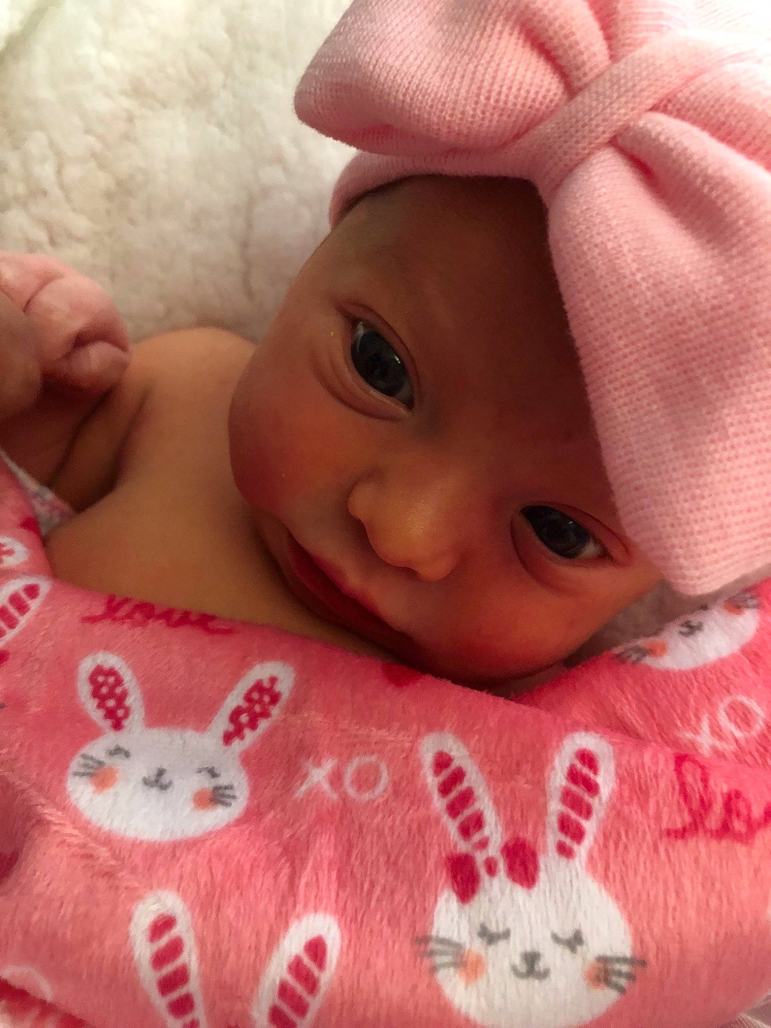 Charity is registered to the contest to win money with this photo: baby, baby_sleeping, bedding, bedtime, birth, cheek, child, close_up, eye, face, forehead, head, headwear, linens, lip, mouth, nose, person, pink, skin