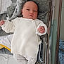 Théa participe au concours pour gagner de l'argent avec cette photo : baby, newborn, infant, crib, blanket, white_clothing, knitted, sleepwear, soft_toys, bed, child, cute, person, indoors, resting, warm, cozy, small_hands, portrait, infant_clothing
