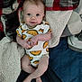 Donald joined the competition — help win amazing prizes! baby, infant, smile, toddler, onesie, taco_pattern, blanket, cozy, lying_down, cute, child, indoor, soft_texture, happy, face, skin, foot, hand, clothing, comfort