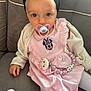 Myla a rejoint le concours — aidez-le/la à gagner de superbes lots ! baby, child, pacifier, headband, pink_dress, minnie_mouse, cat_clip, couch, cozy, white_tights, hand, cute, indoor, portrait, infant, soft_lighting, clothing, accessory, seated, adorable