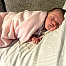 Ellie is registered to the contest to win money with this photo: baby, blanket, sleeping, pillow, couch, soft, cozy, peaceful, infant, rest, indoors, child, wrapped, face, head, relax, comfort, bedtime, nap, cute