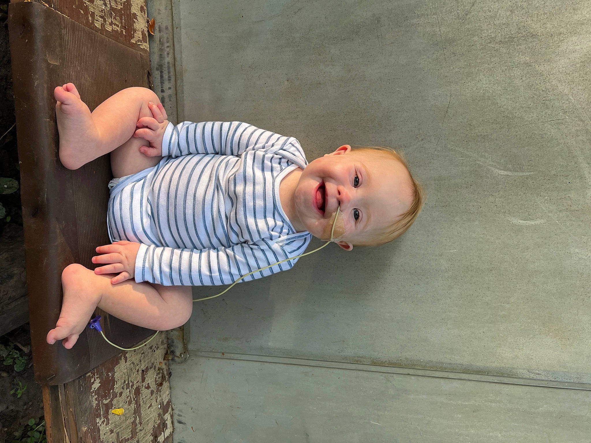 Jagger joined the competition — help win amazing prizes! art, baby, baby_toddler_clothing, child, concrete, dress, eye, foot, fun, grass, human_leg, joy, pattern, person, plant, sitting, skin, smile, thigh, toddler