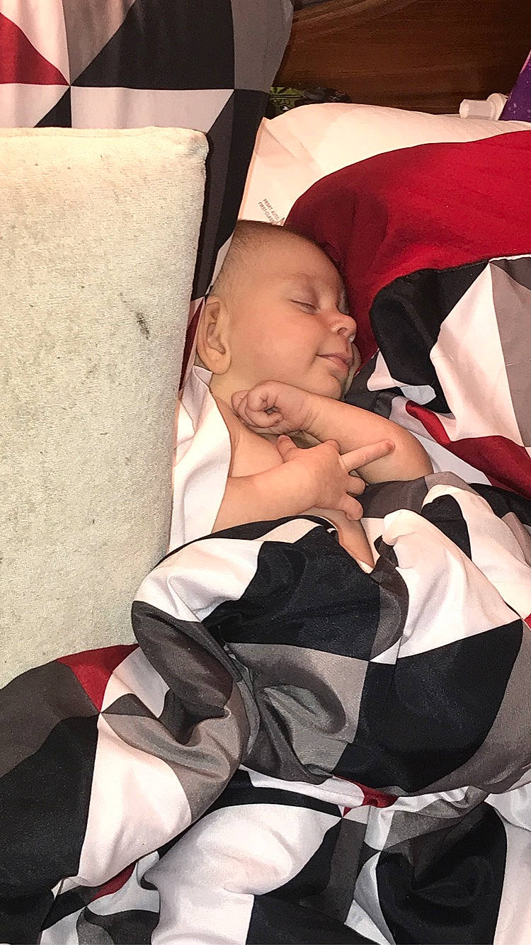 Aleigha is registered to the contest to win money with this photo: baby, baby_carriage, baby_products, baby_safety, baby_sleeping, baby_toddler_clothing, car_seat, carmine, chest, child, comfort, fun, human_leg, lap, linens, nap, person, sitting, sleep, thigh