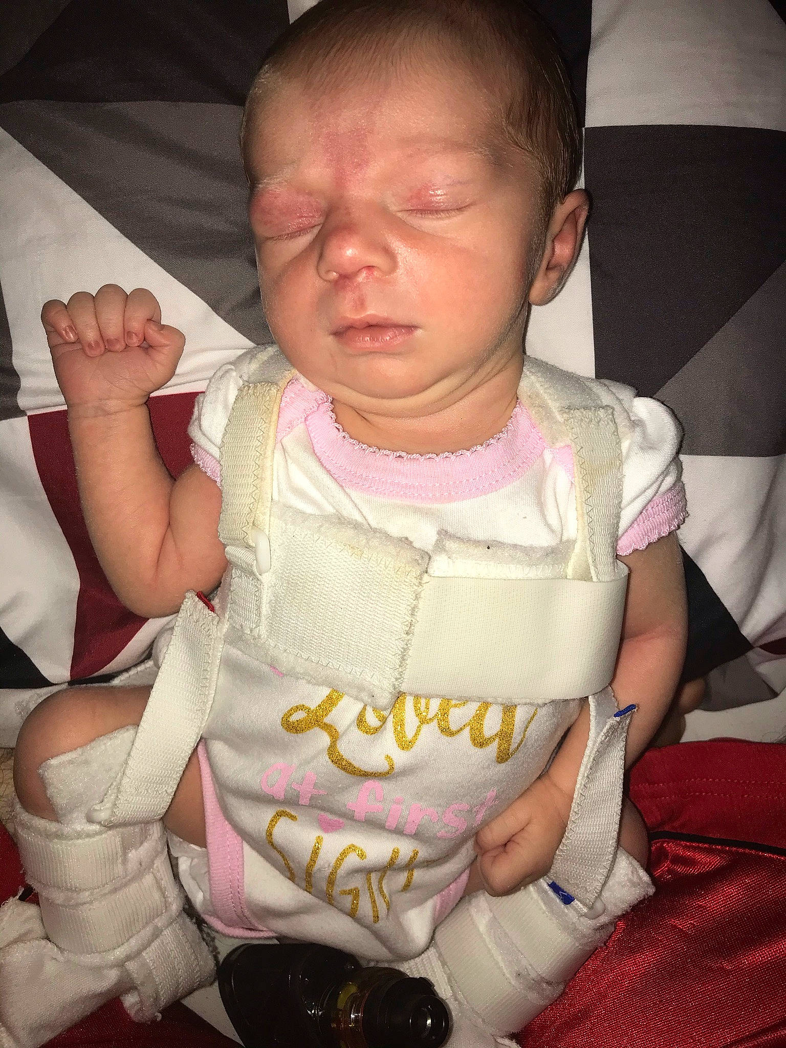 Aleigha is registered to the contest to win money with this photo: baby_toddler_clothing, cheek, chin, comfort, dress, eye, eyelash, facial_expression, gesture, hairstyle, hand, happy, head, human_body, mouth, neck, person, pink, skin, sleeve