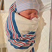 Blake joined the competition — help win amazing prizes! newborn, baby, hospital, blanket, striped, hat, sleeping, bassinet, infant, wrapped, bed, medical, patient, cute, child, person, indoors, resting, soft, peaceful