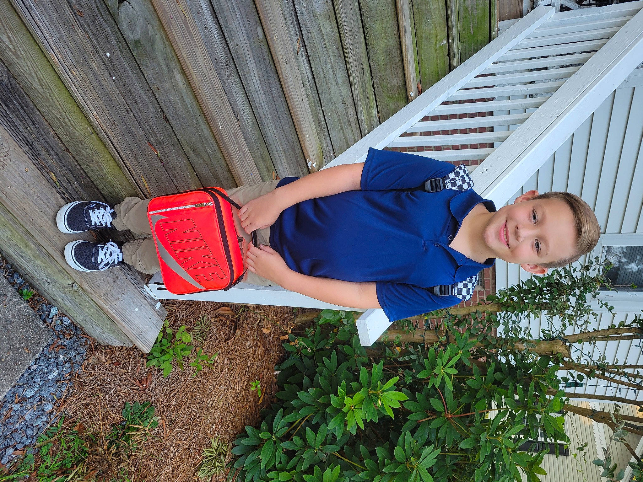 Jaxon is registered to the contest to win money with this photo: elbow, electric_blue, fun, hat, human_leg, joy, knee, leisure, people_in_nature, person, plant, sweatpant, t_shirt, thigh, tree, vacation, walking_shoe, wood, wrist