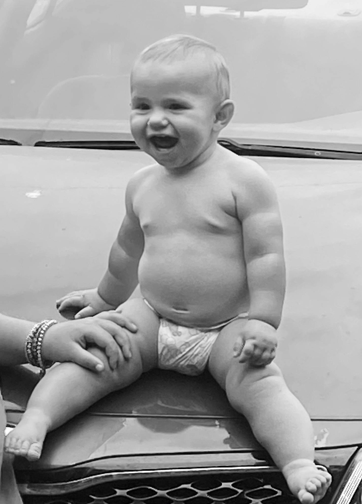 Kole is registered to the contest to win money with this photo: black, black_and_white, chest, finger, gesture, happy, human_body, joint, knee, leg, mouth, muscle, person, shorts, shoulder, skin, smile, standing, style, thigh