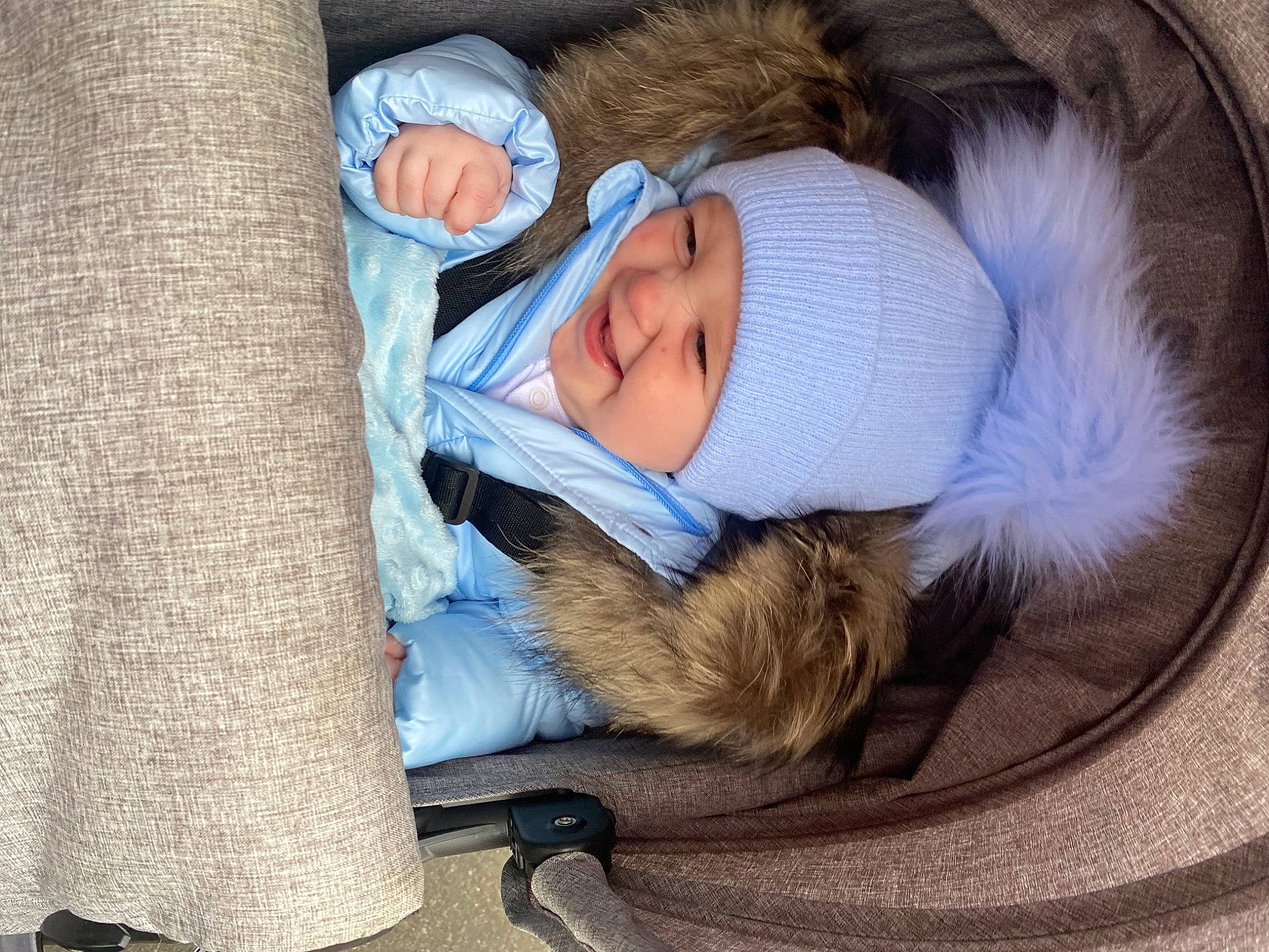 George is registered to the contest to win money with this photo: baby, baby_products, baby_sleeping, baby_toddler_clothing, beanie, bedtime, child, comfort, electric_blue, fur, headwear, knit_cap, linens, nap, person, sitting, sleep, textile, toddler, winter
