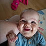 Maxence a rejoint le concours — aidez-le/la à gagner de superbes lots ! arm, baby, buttoned_shirt, child, closeup, cute, floor, hand, happy, holding, indoor, infant, person, pink_sandals, portrait, rug, skin, smiling, striped_shirt, wooden_floor
