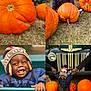 child, toddler, pumpkin, hat, winter_clothing, jacket, outdoor, autumn, smiling, laughing, vintage_car, ford, grass, people, festival, holding_hands, colorful, playful, nature, daylight
