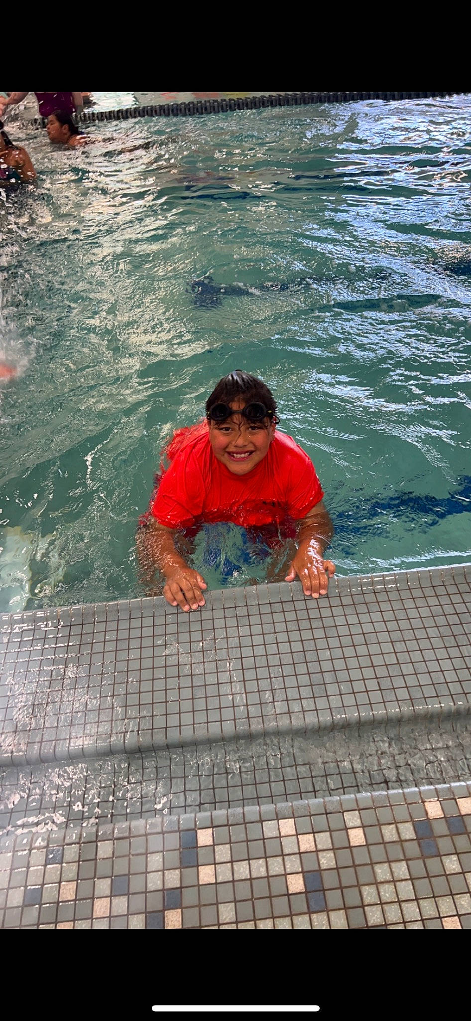 Izaac joined the competition — help win amazing prizes! azure, child, coast, flooring, fun, happy, joy, leisure, ocean, people, person, recreation, sea, shorts, sidewalk, sitting, tourism, vacation, water, wave