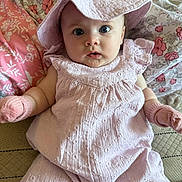 Aurora-Rose is registered to the contest to win money with this photo: baby, child, pink_clothing, hat, mittens, floral_blanket, cute, portrait, indoor, infant, soft_fabric, wide_eyes, sitting, closeup, adorable, young_child, baby_girl, cozy, expression, face