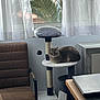animal, cat, cat_tree, chair, cozy, curtains, curtains_sheer, daylight, furniture, gray_cat, home, indoor, laptop, modern, pet, relaxed, resting, soft_light, table, window