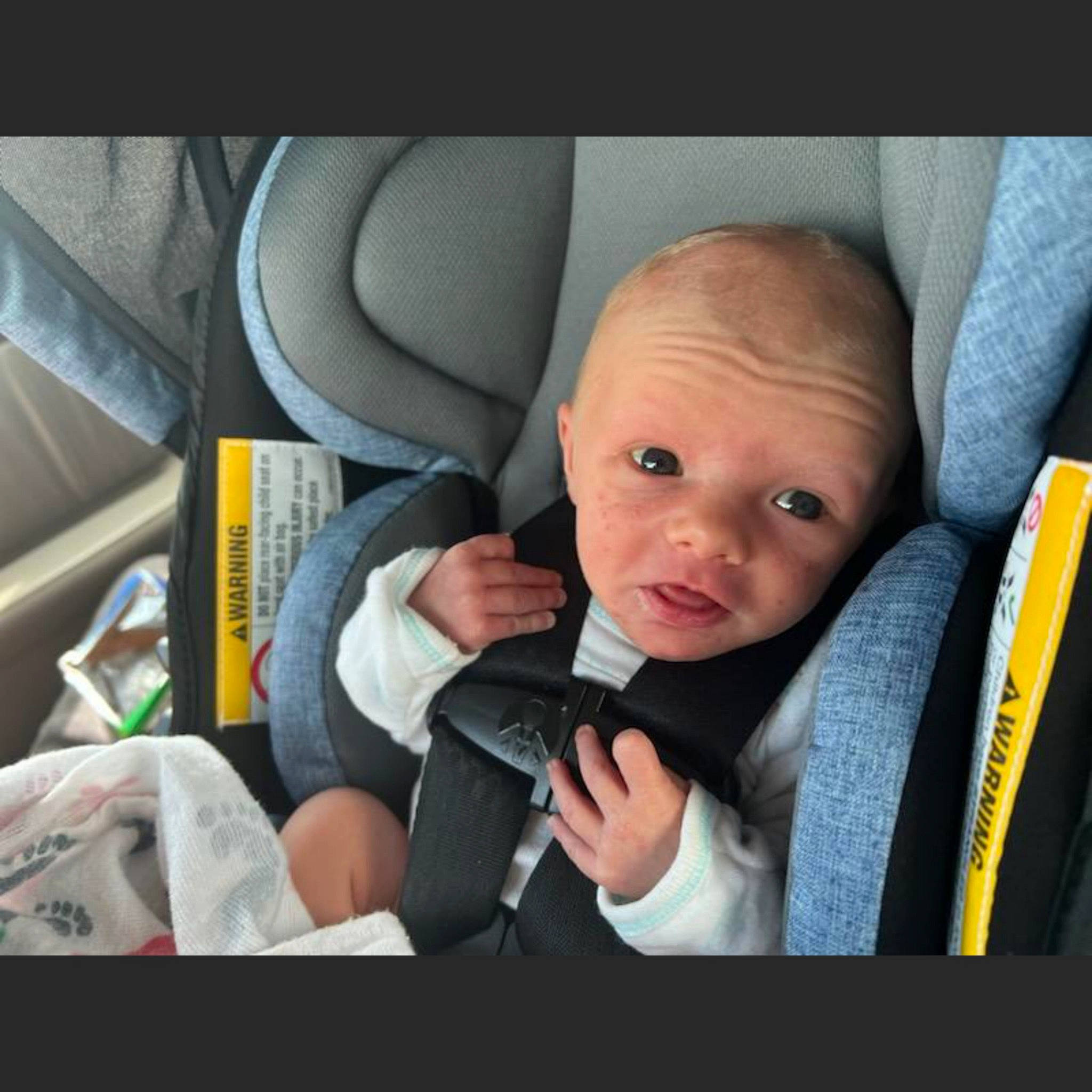 Jaxtyn is registered to the contest to win money with this photo: auto_part, automotive_design, automotive_exterior, baby, baby_products, baby_toddler_clothing, car_seat, car_seat_cover, child, comfort, family_car, finger, happy, head_restraint, motor_vehicle, person, personal_luxury_car, seat_belt, steering_wheel, toddler